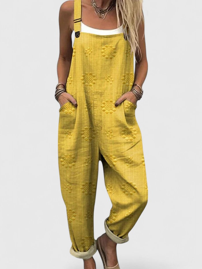 Stylish women's floral embroidered jumpsuit with a relaxed fit, useful pockets & adjustable straps for casual wear.