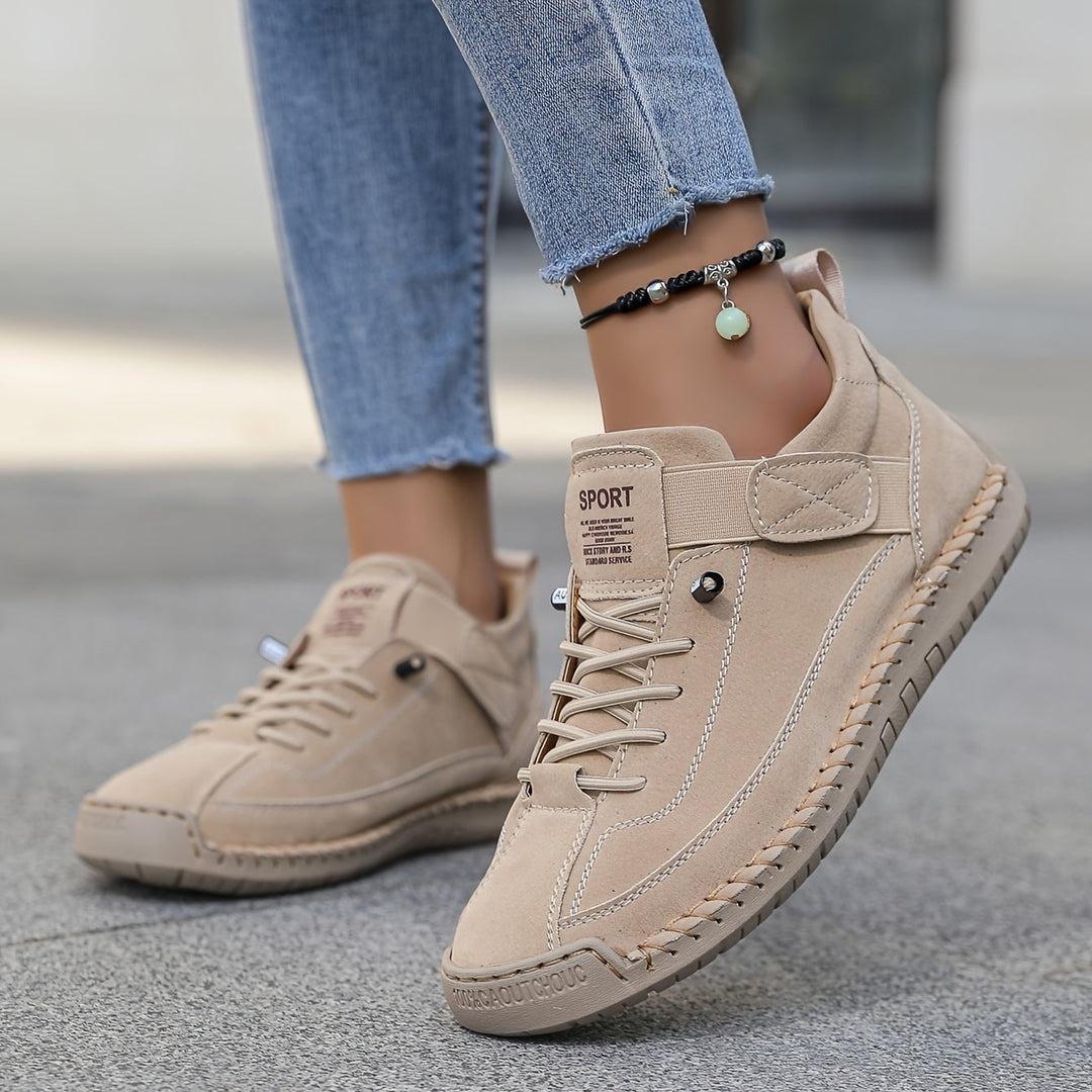 Women's casual lace-up sneakers with stitched details, perfect for everyday comfort and versatile styling.