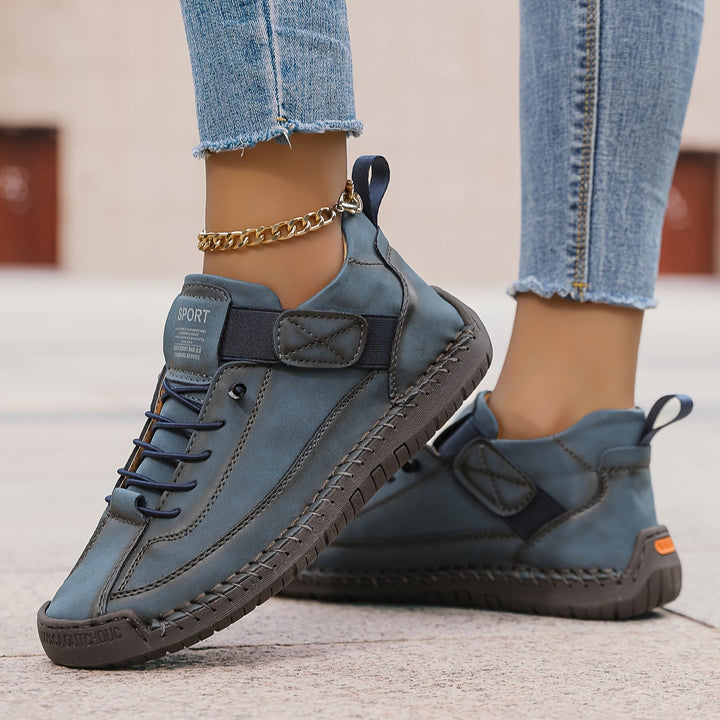 Side view of women's casual low-top sneakers, showcasing the comfortable sole and lace-up closure.