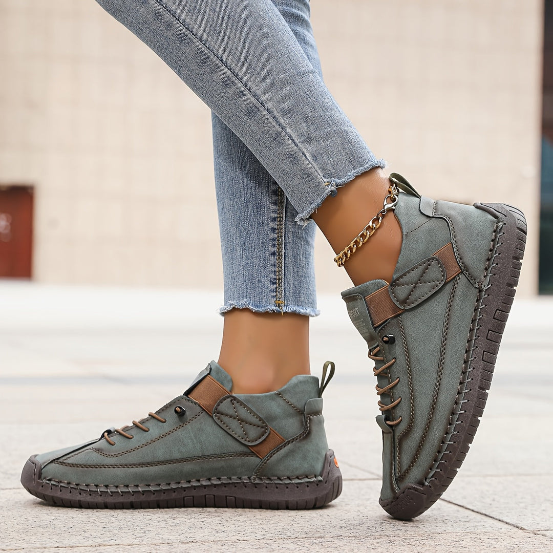 Women's comfortable everyday sneakers, lace-up style, shown worn for a stylish and relaxed look.
