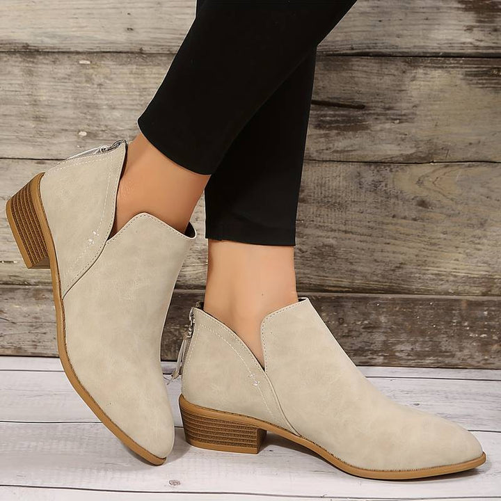 Versatile women's fashion ankle boots with a low heel and easy slip-on design for a chic casual look.