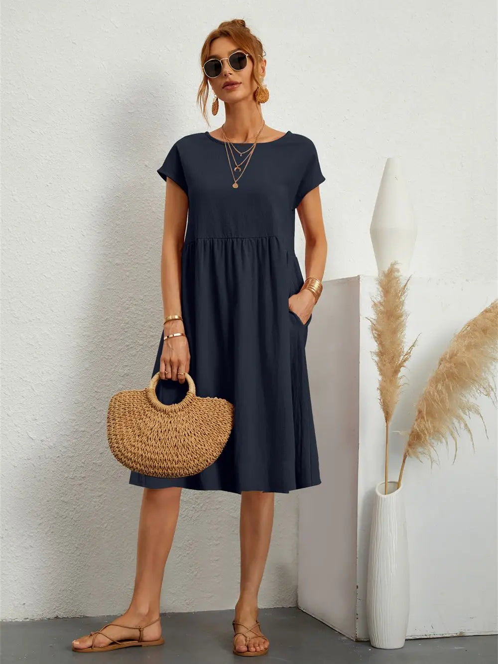 Front view: women's short sleeve midi dress with pockets, ideal for ladies' comfortable everyday fashion.