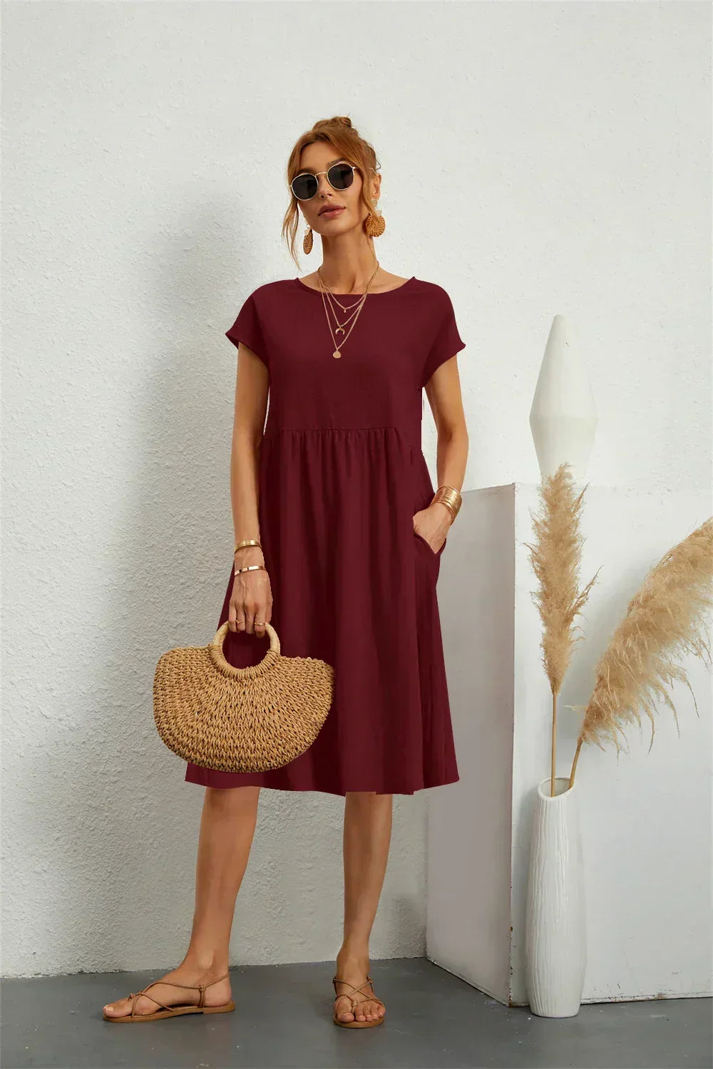 Effortless women's casual midi dress, short sleeves & pockets, for versatile spring & summer fashion.