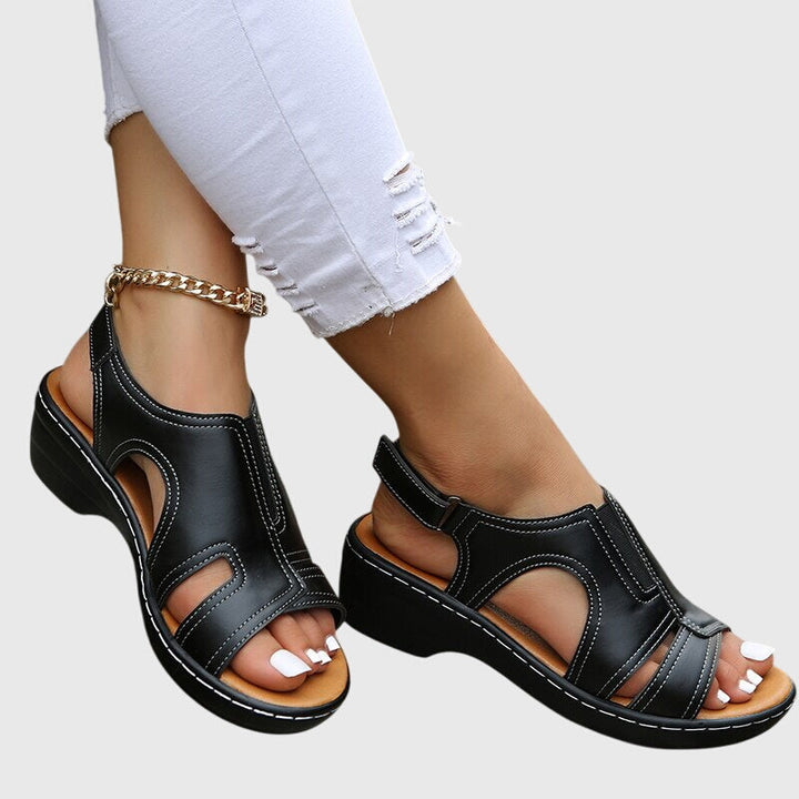 Comfortable women's casual peep toe wedge sandals with supportive slingback. Ideal summer footwear.