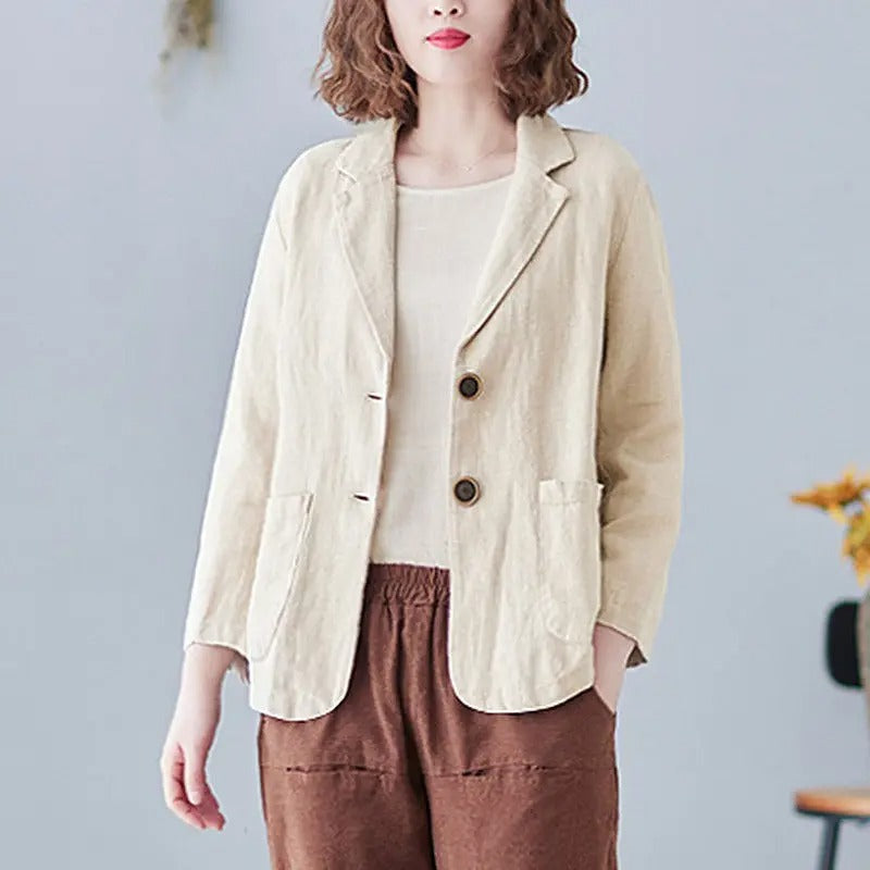 Female model wearing a chic women's relaxed fit single-breasted blazer with casual pants, ideal for spring.