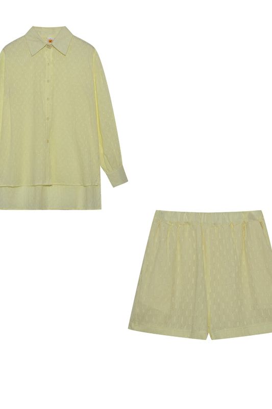 Chic women's effortless shirt and shorts combo, a must-have for your summer wardrobe.