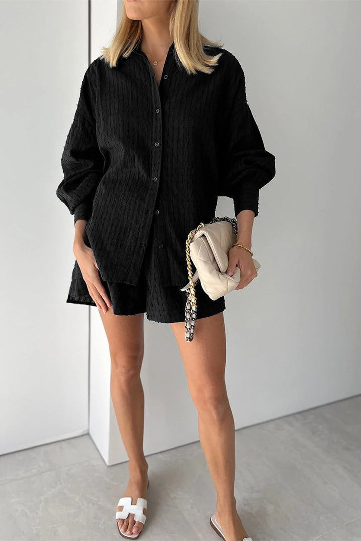 Fashionable women's shirt and shorts two-piece outfit, perfect for spring and summer style.