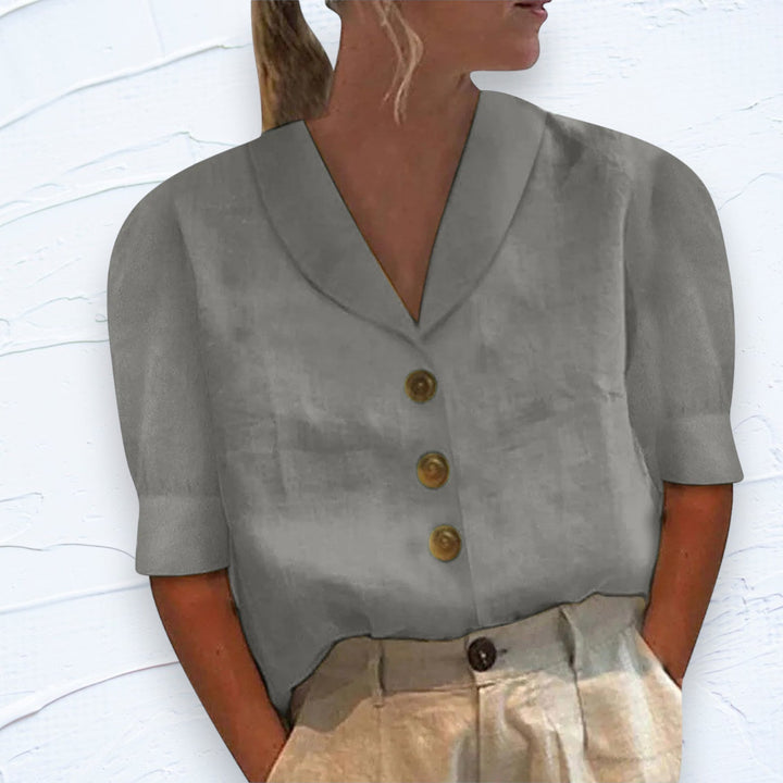 Versatile women's relaxed fit shirt with short sleeves & button front. Great for casual summer everyday wear.
