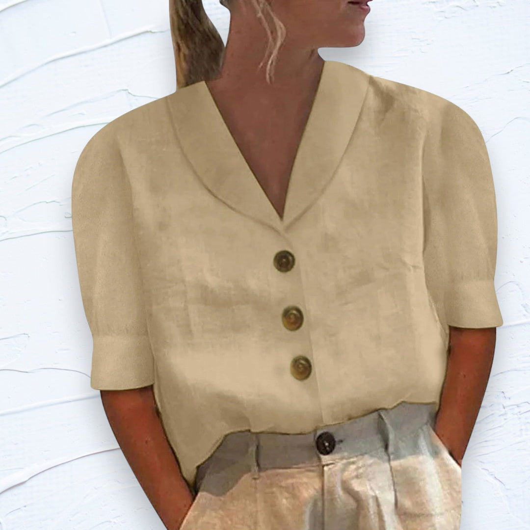 Comfortable women's short sleeve button-up shirt for casual wear. Perfect everyday top for summer fashion.