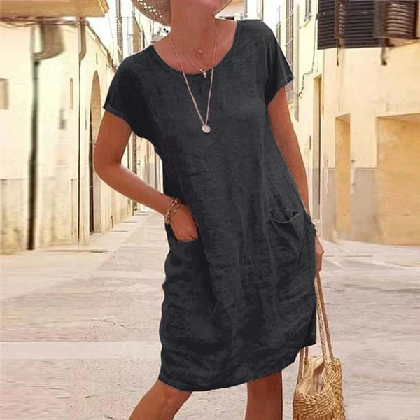 Women's casual short sleeve midi dress with pockets, ideal for comfortable everyday wear and summer fashion.