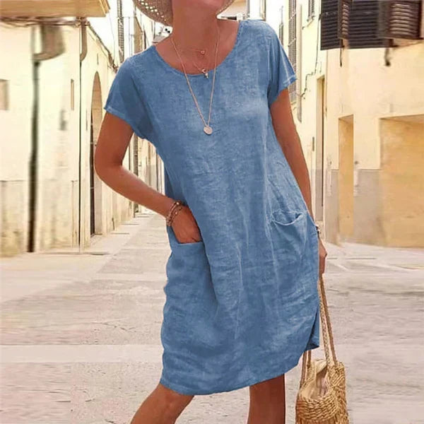 Stylish women's short sleeve casual midi dress featuring practical pockets, great for everyday comfort and summer.