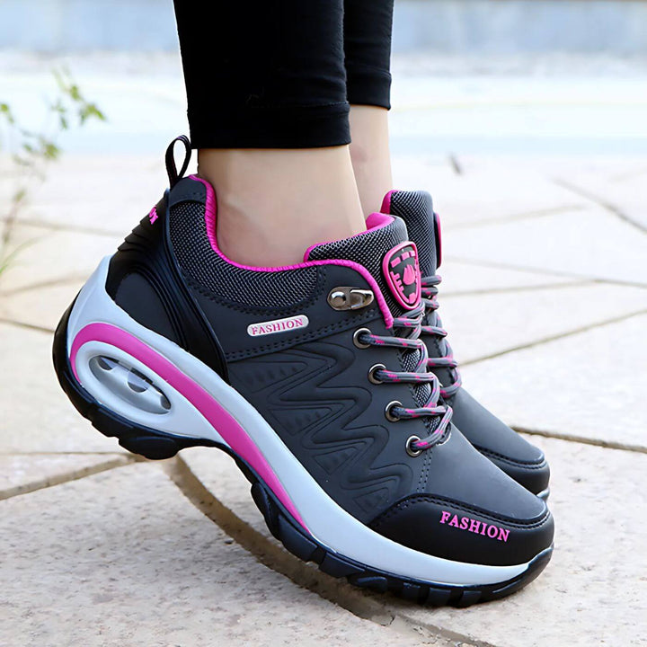 Charcoal grey women's casual sneakers with arch support, providing breathable comfort for everyday wear.