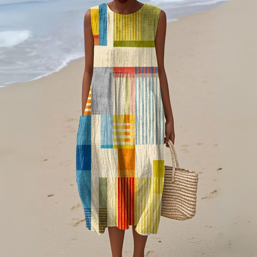 Women's casual striped patchwork midi dress with pockets, sleeveless, comfortable, ideal for summer outfits.