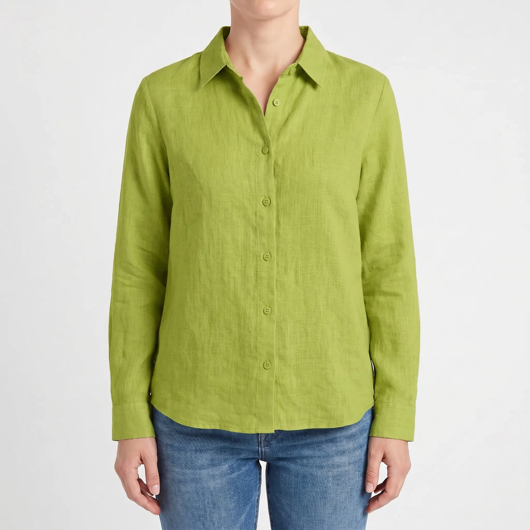 Woman wearing a chic casual summer blouse with long roll-up sleeves, a comfortable everyday top.