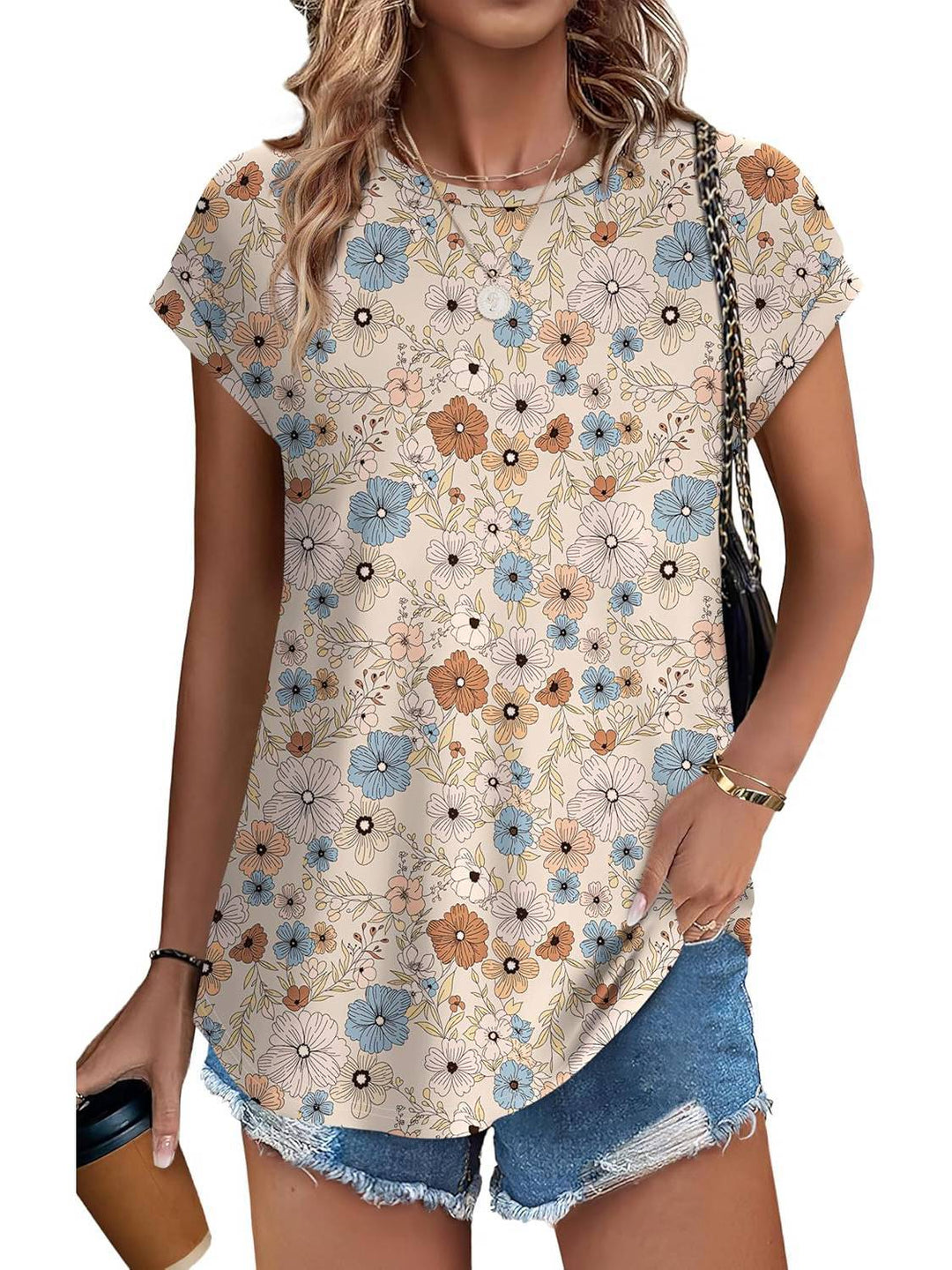 Relaxed fit women's top, adorned with a chic leaf design. Great for comfortable everyday wear.