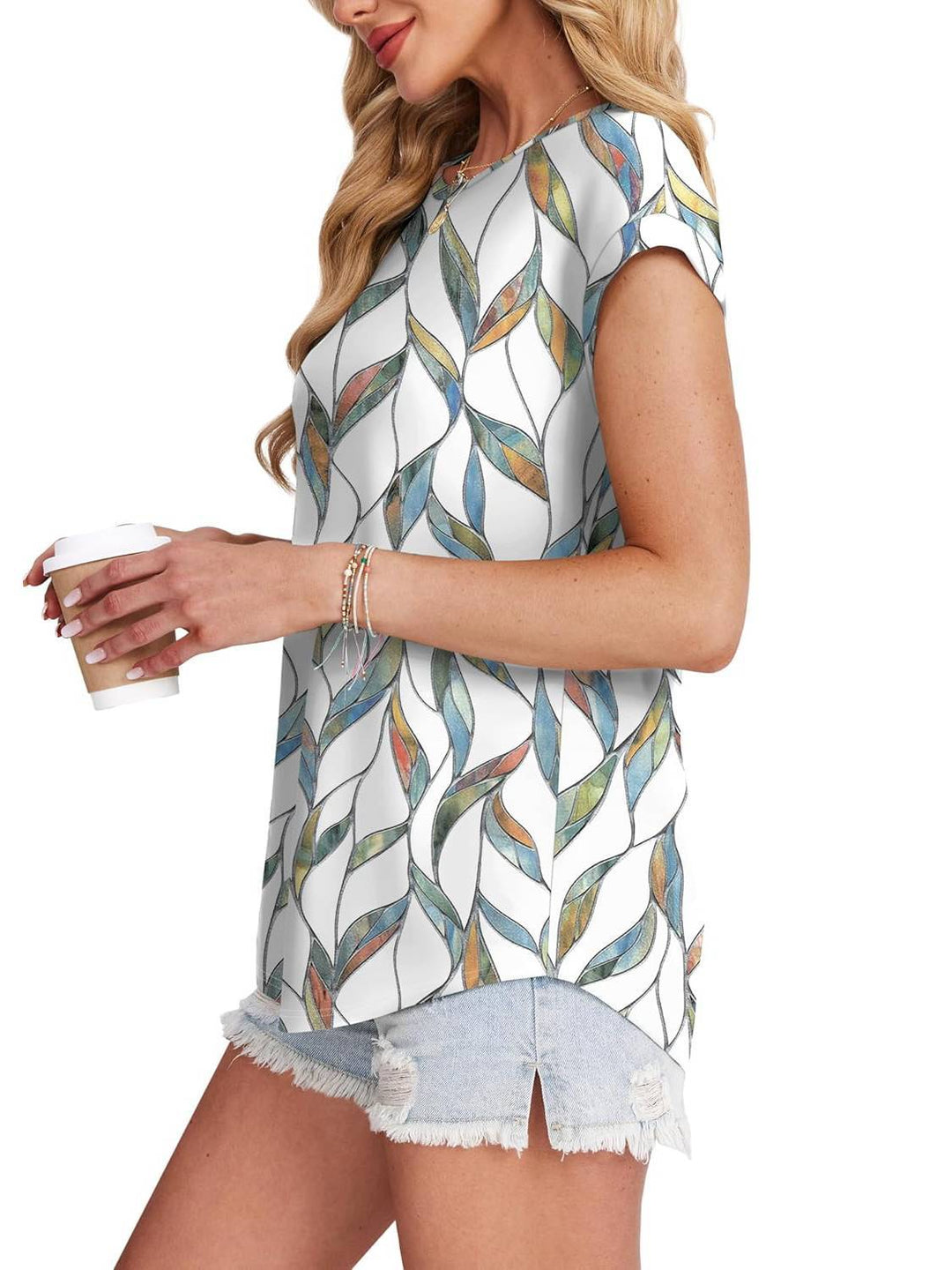 Elegant leaf print crew neck top for women. A comfortable and stylish addition to your wardrobe.