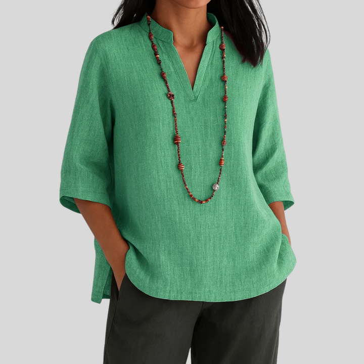 Women's casual V-neck 3/4 sleeve blouse. Relaxed fit top perfect for everyday wear and versatile styling.