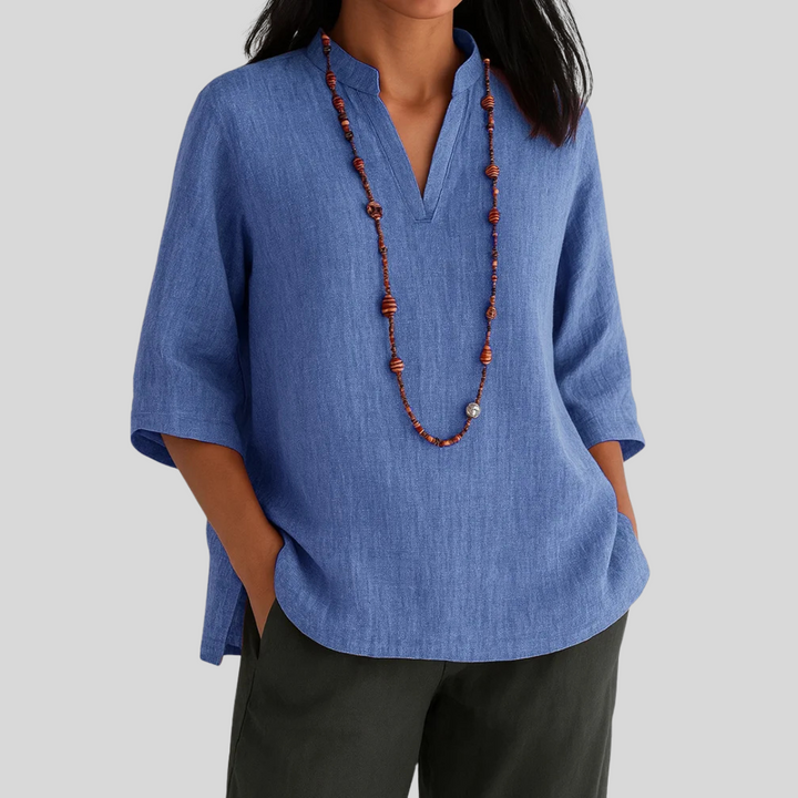Stylish women's V-neck 3/4 sleeve relaxed blouse, ideal for spring, summer, or smart casual outfits.