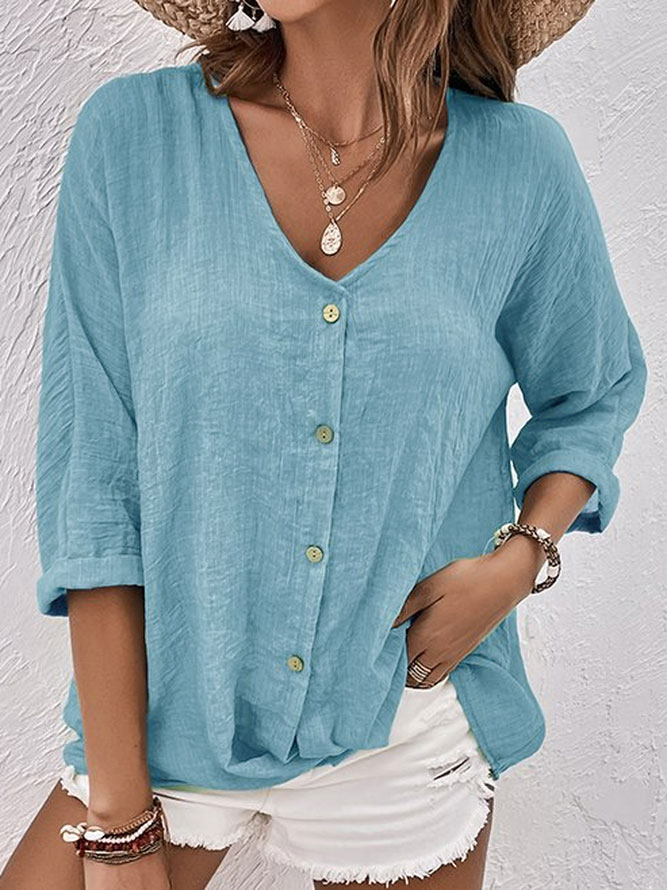 Women's casual V-neck button down shirt with long sleeves, perfect for everyday relaxed summer and spring wear.