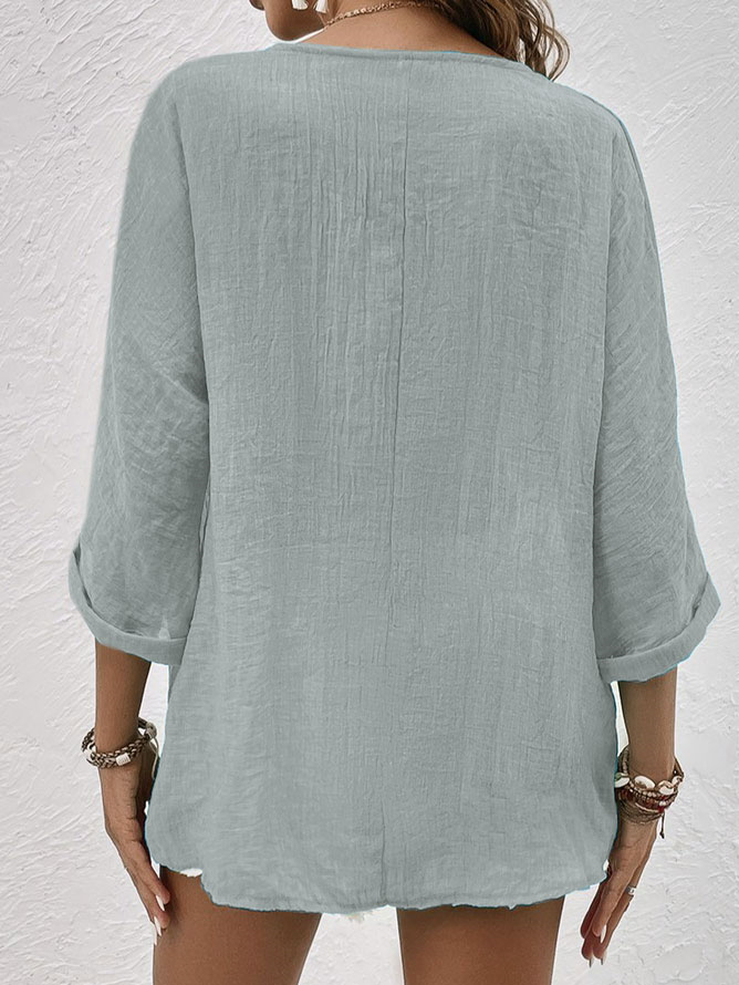 Lightweight women's V-neck button down shirt, a comfortable long sleeve casual top ideal for versatile spring outfits.