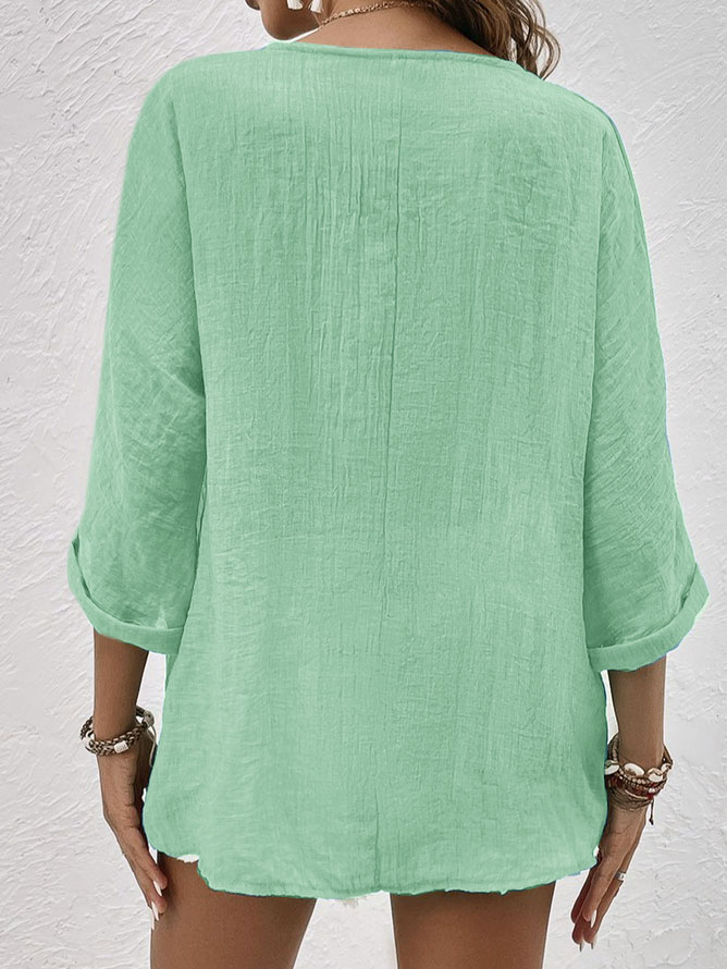 Stylish women's V-neck button down shirt with front buttons, a chic long sleeve casual blouse for everyday wear.