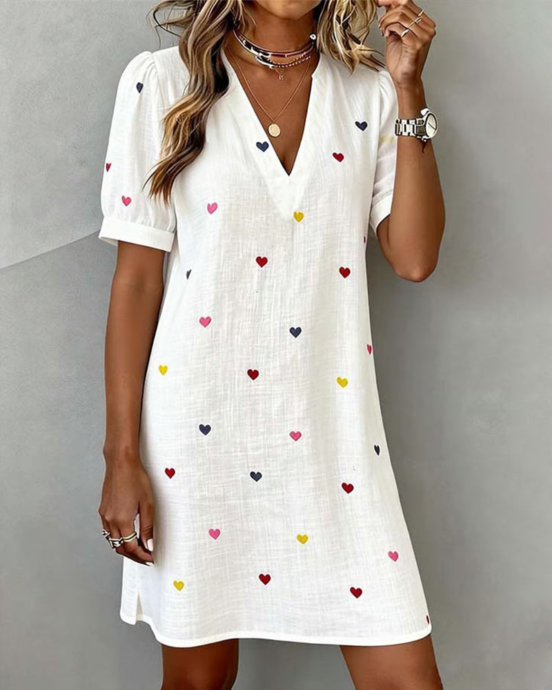 Women's casual V-neck mini dress with puff sleeves & cute heart print. Relaxed fit for summer comfort.