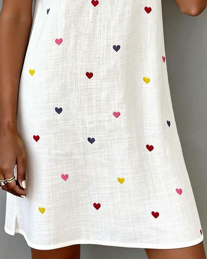Comfortable women's heart print V-neck dress. Puff sleeves, relaxed fit, perfect everyday summer wear.
