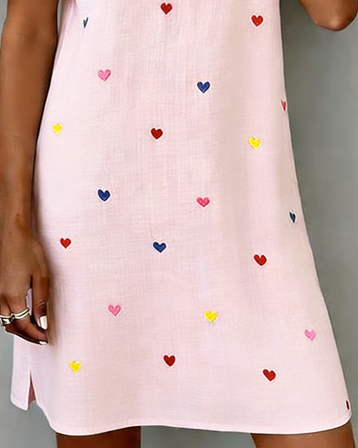 Stylish women's summer dress with puff sleeves, V-neck & delightful heart print. Ideal for casual days.