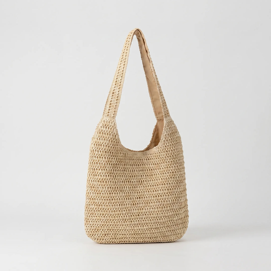 Effortless women's woven shoulder tote. Ideal casual handbag for beach, market trips, or daily summer outfits.