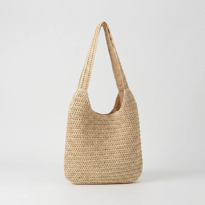 Effortless women's woven shoulder tote. Ideal casual handbag for beach, market trips, or daily summer outfits.