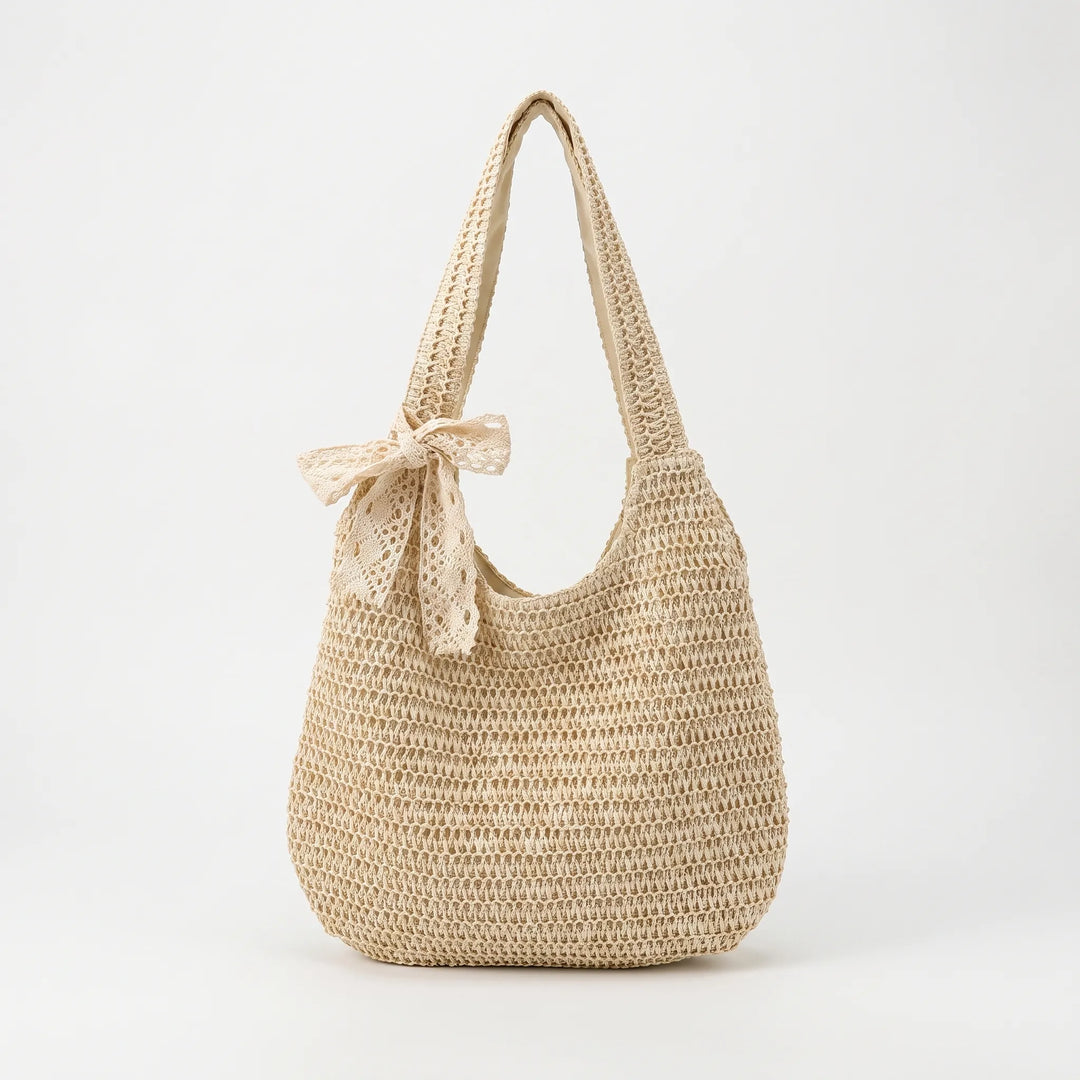 Open-top women's woven shoulder tote bag. Spacious & light, ideal for a casual summer day or beach outing.