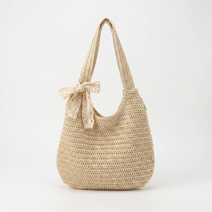 Open-top women's woven shoulder tote bag. Spacious & light, ideal for a casual summer day or beach outing.