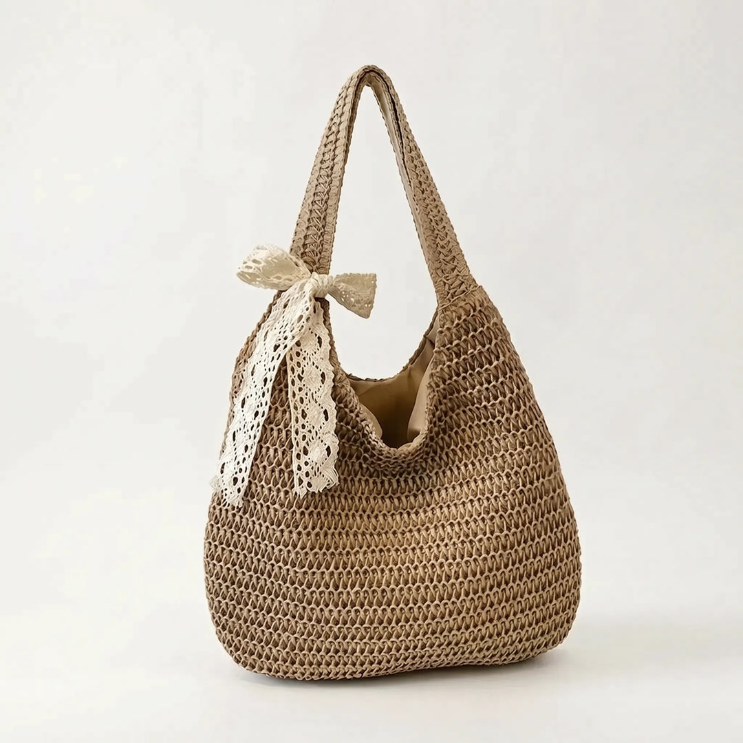 Lightweight women's woven shoulder tote. Spacious, casual, and perfect for summer, beach days, or everyday use.