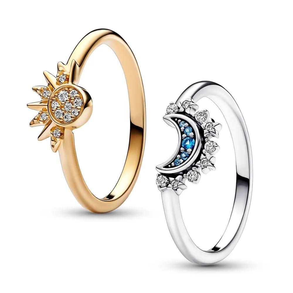 Versatile women's statement ring featuring a celestial sun & moon, sparkling accents. Silver-tone elegant jewelry.