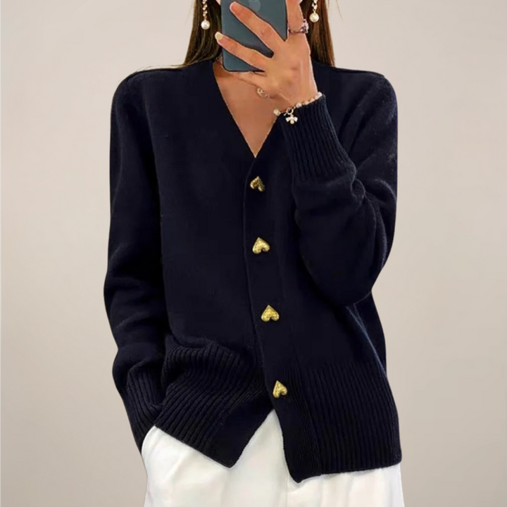 Women's chic cardigan with gold heart buttons. Versatile long-sleeve layering piece.