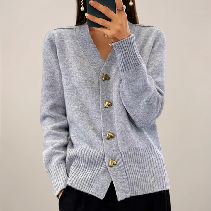 Elegant women's long-sleeve cardigan sweater with gold heart buttons. Relaxed fit, casual chic top.