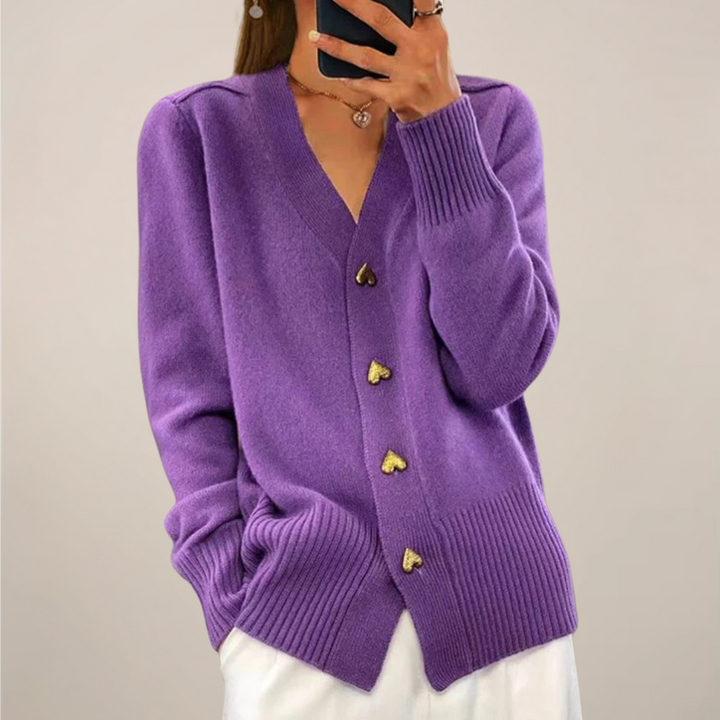 Stylish women's long-sleeve cardigan sweater, perfect for layering. Features elegant gold heart buttons.