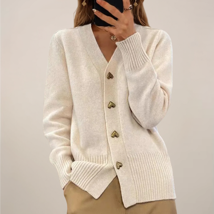 Women's versatile long-sleeve cardigan sweater with charming gold heart buttons. An elegant womenswear top.