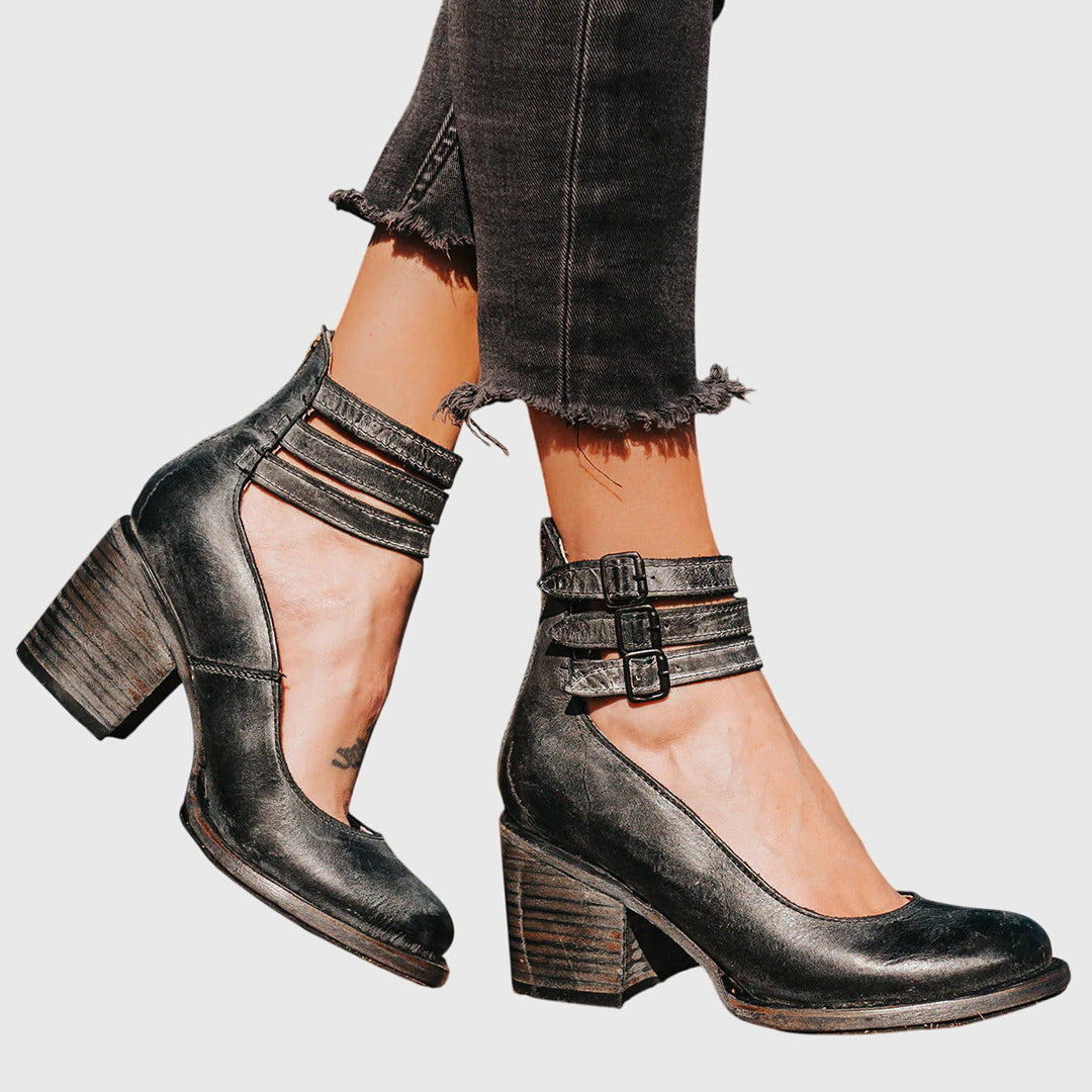 Comfortable women's chic cutout ankle boots with a fashionable buckle and stable block heel design.