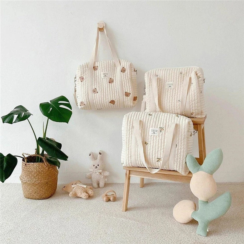 Premium embroidered hobo diaper bag for women, cotton, perfect for keeping newborn essentials organized.