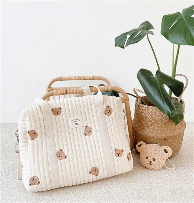 Cotton maternity hobo diaper bag, chic embroidery, spacious for baby travel and newborn essentials.