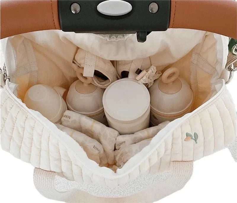 Stylish cotton embroidered hobo diaper bag for mom & baby essentials; features bear, tulip, olive prints.