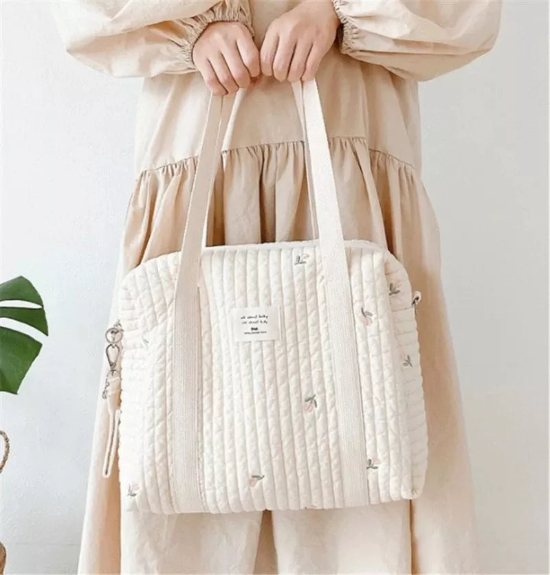 Embroidered hobo diaper bag with a charming bear print, cotton, ideal for carrying newborn essentials.