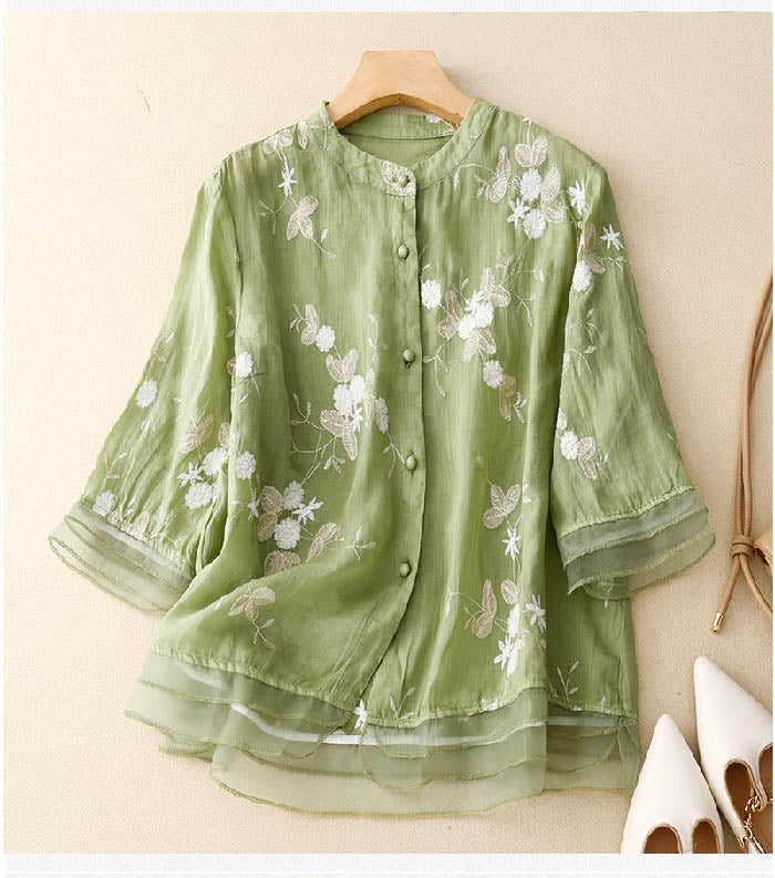 Women's chic floral blouse, elegant summer top with short sleeves. Perfect for casual or sophisticated looks.