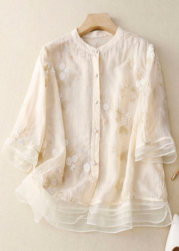 Relaxed fit women's floral blouse, a versatile and chic short sleeve top for elegant summer fashion.