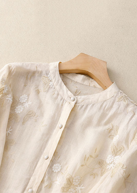 Elegant women's summer blouse with delicate floral print, a chic short sleeve top for versatile fashion.