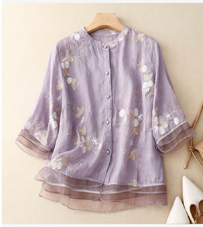 Chic women's floral summer top, an elegant short sleeve blouse designed for comfortable and fashionable wear.