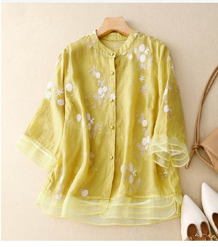 Sophisticated women's floral blouse, a versatile short sleeve summer top perfect for elegant casual fashion.