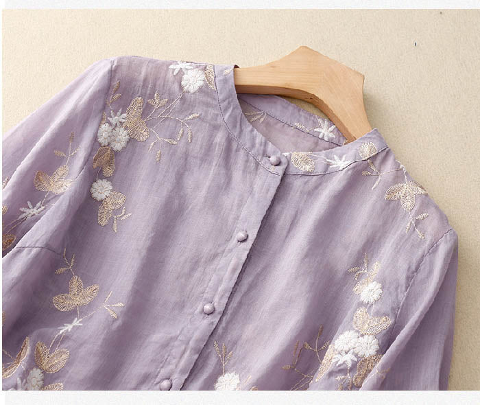 Vibrant floral print women's blouse, an elegant short sleeve summer top with a chic and relaxed fit.