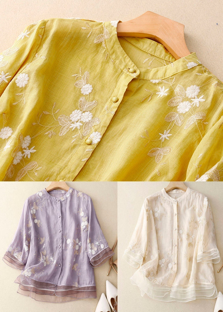 Women's elegant floral blouse, a short sleeve summer top with a chic design and comfortable relaxed fit.